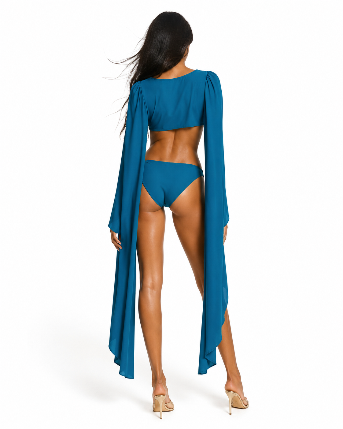 Full-length back view of the Aurelia Emerald cut-out one-piece by May Rose showcasing fluid cape sleeves and a sophisticated luxury swimwear silhouette.