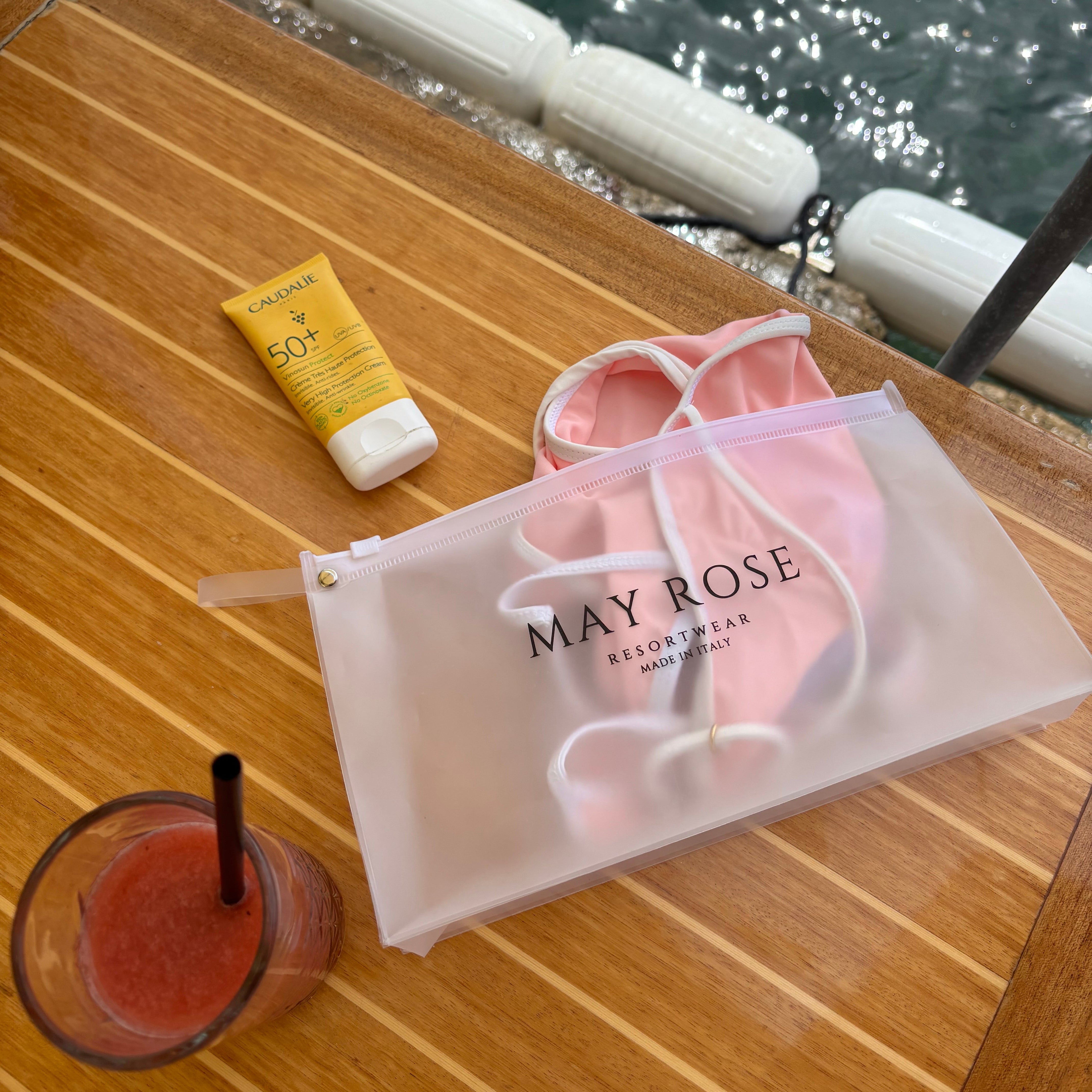 may rose swimwear packed in travel pouch ready for mediterranean summer