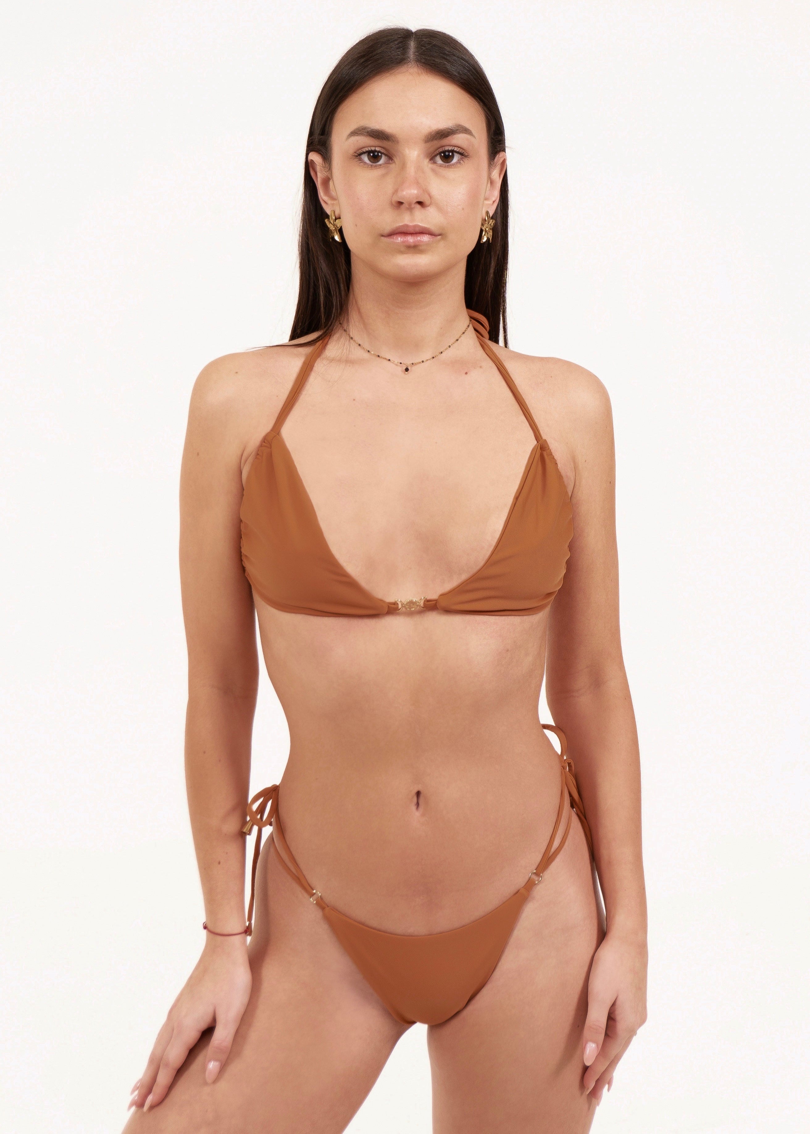 Front view of the May Rose Chia Patchouli camel bralette bikini top with double tie straps, 18K gold-plated charm at center chest and matching tie-side bottom
